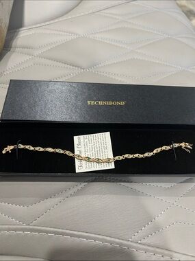 Technibond Gold-Tone Bracelet with Emerald-Green Accents. Size 8